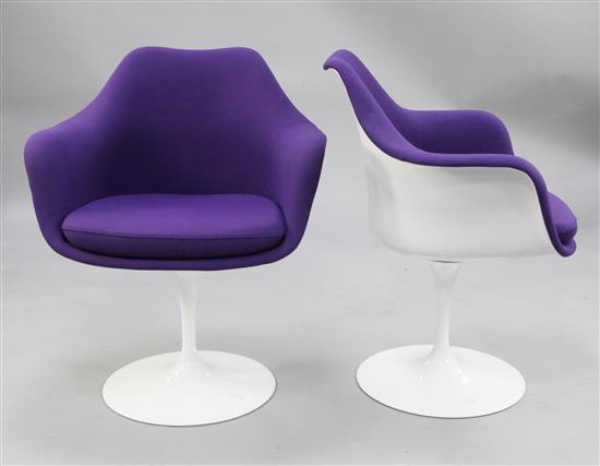 After Eero Saarinen. A pair of fibre glass tulip chairs,